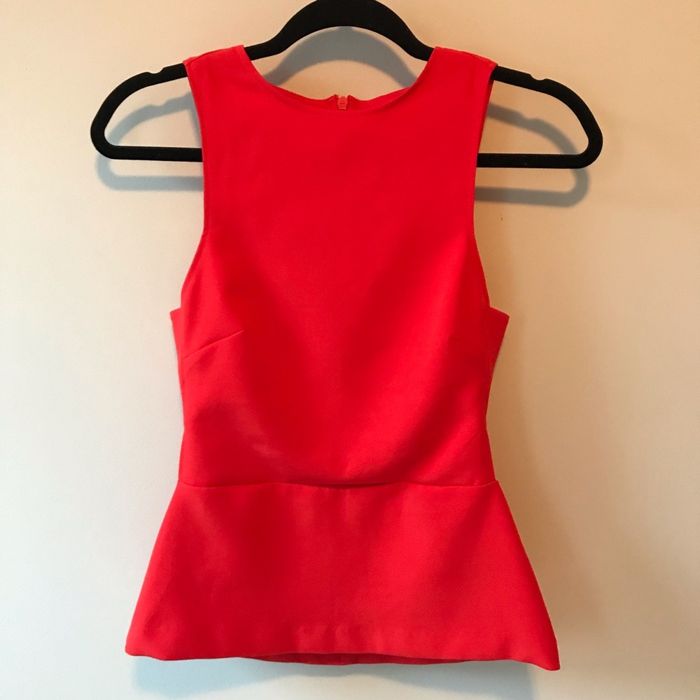 Peplum top with side cut outs